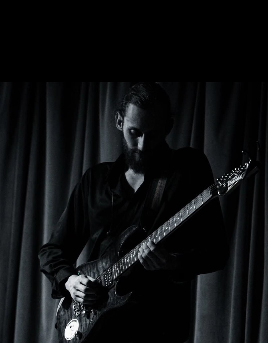 Samuel Cash playing guitar